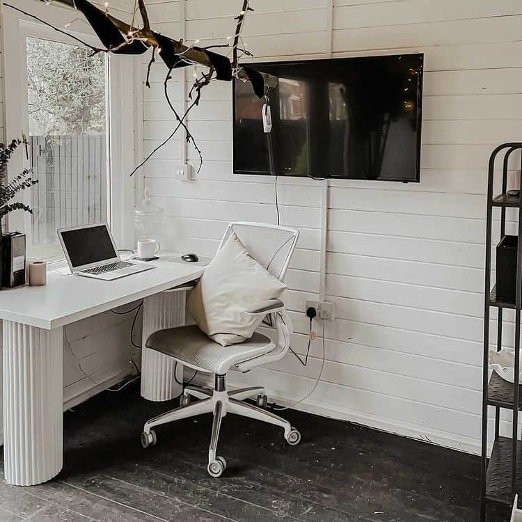 BillyOh Fraya Pent Summerhouse interior painted white with desk and office chair and wall-mounted TV